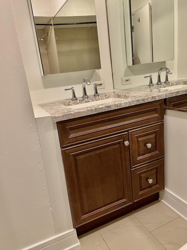 5424 W Ferdinand St Unit 104, Chicago, IL 60644 - bathroom with tile patterned floors, vanity, and baseboards