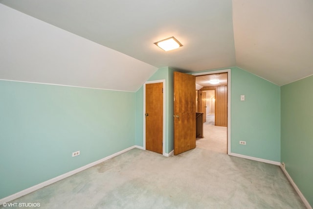 bonus room featuring baseboards, carpet, and vaulted ceiling