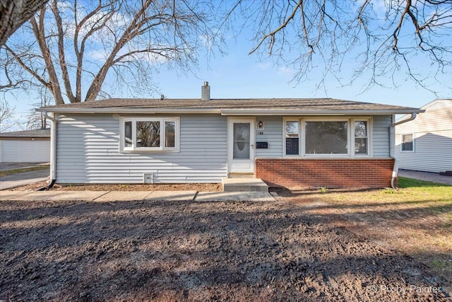 128 Adobe Cir, Carpentersville, IL 60110 - view of front of house with brick siding and a chimney