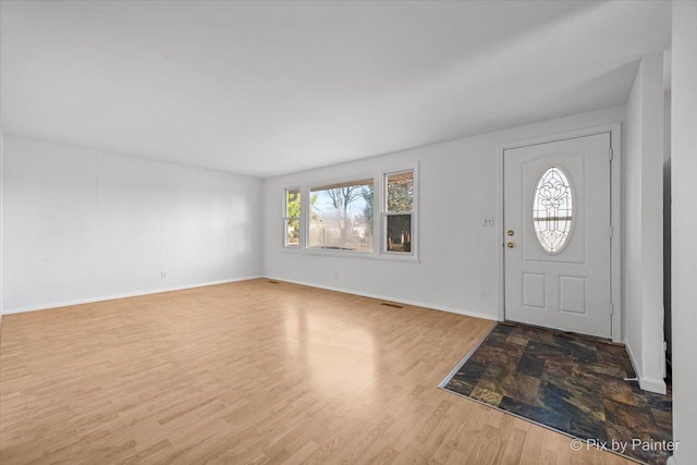 128 Adobe Cir, Carpentersville, IL 60110 - entrance foyer featuring visible vents, baseboards, and wood finished floors