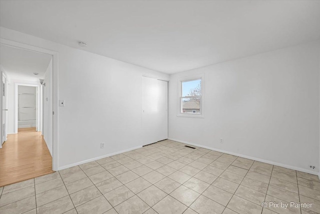 128 Adobe Cir, Carpentersville, IL 60110 - spare room with baseboards and visible vents