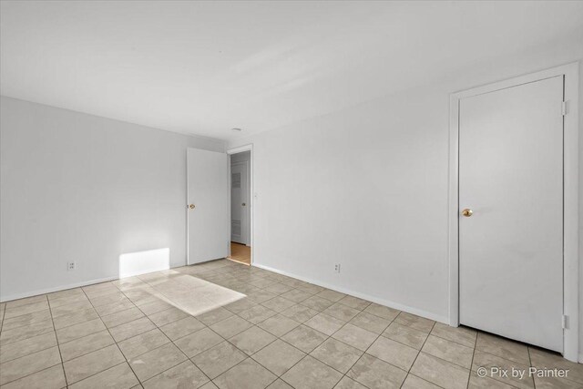 128 Adobe Cir, Carpentersville, IL 60110 - unfurnished room featuring light tile patterned floors and baseboards