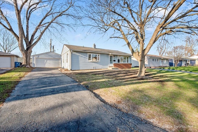 128 Adobe Cir, Carpentersville, IL 60110 - ranch-style house with a garage, a front yard, an outdoor structure, and a chimney