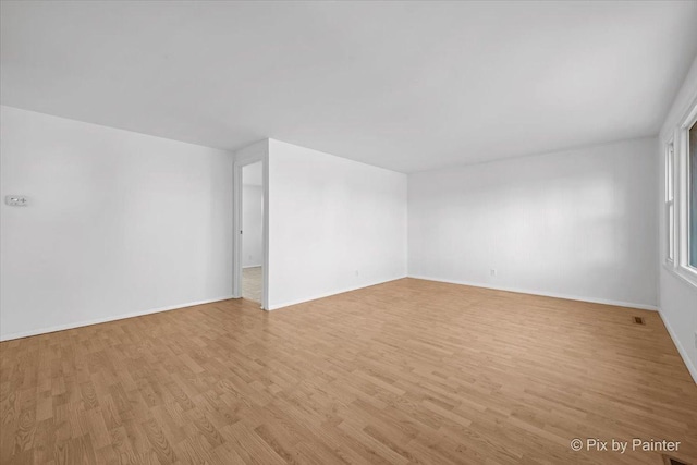 128 Adobe Cir, Carpentersville, IL 60110 - spare room featuring light wood finished floors and baseboards