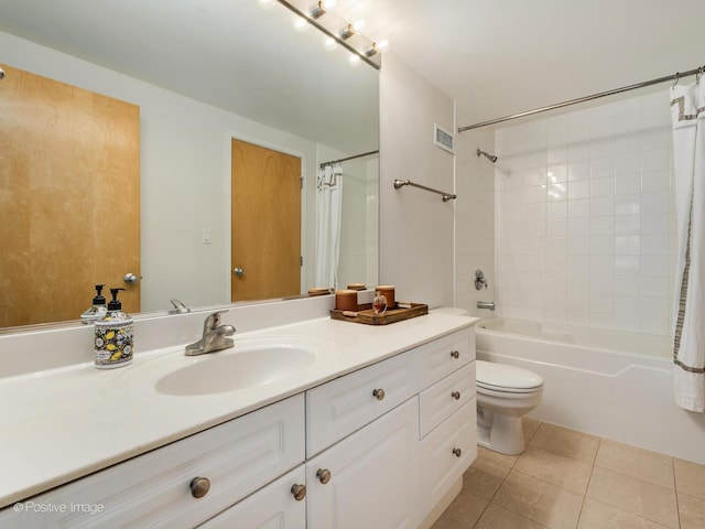 full bathroom featuring visible vents, shower / bath combination with curtain, toilet, vanity, and tile patterned floors