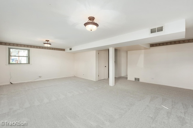 below grade area with light carpet and baseboards