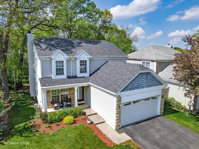 14 Wildflower Way, Streamwood, IL 60107 - traditional-style home with a chimney, a garage, a shingled roof, and driveway