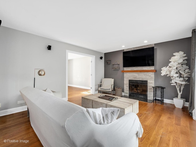 14 Wildflower Way, Streamwood, IL 60107 - living area with a large fireplace, wood finished floors, recessed lighting, and baseboards