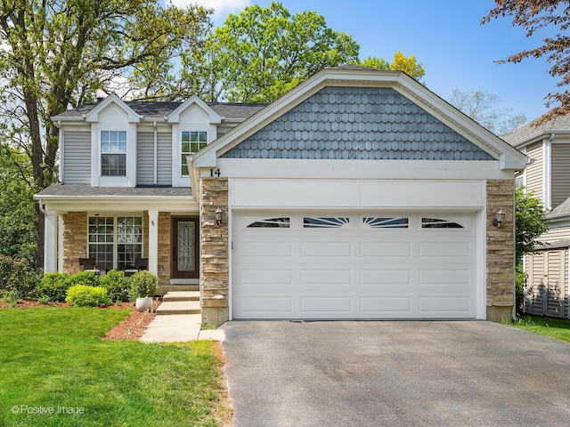 14 Wildflower Way, Streamwood, IL 60107 - view of front of home with stone siding, asphalt driveway, a garage, a front lawn, and a shingled roof