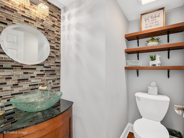 14 Wildflower Way, Streamwood, IL 60107 - half bath featuring toilet, vanity, baseboards, and backsplash