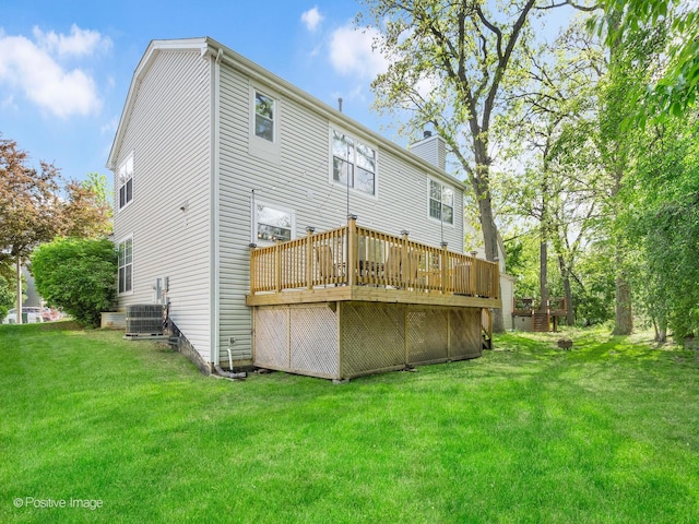 14 Wildflower Way, Streamwood, IL 60107 - rear view of house with a chimney, a wooden deck, a lawn, and central AC unit