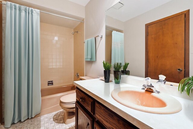 bathroom with vanity, toilet, and shower / bath combination with curtain