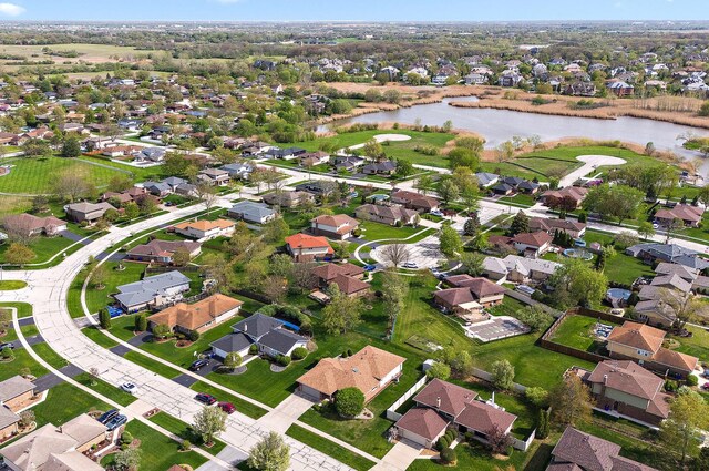 aerial view with a residential view and a water view
