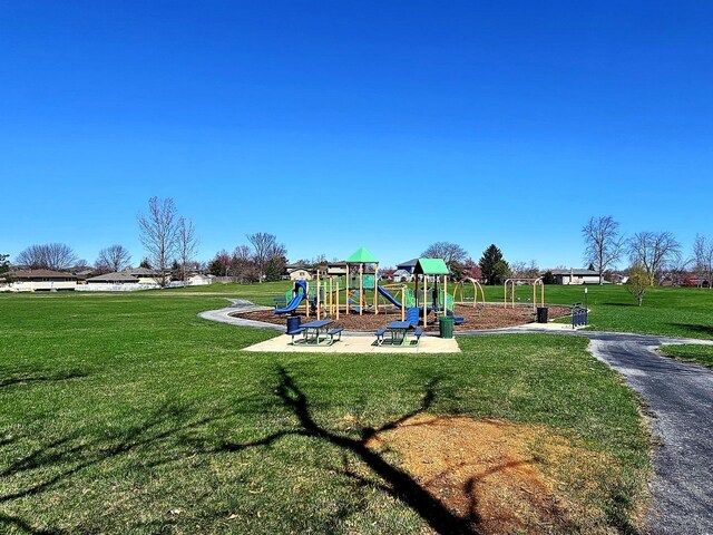 communal playground featuring a yard