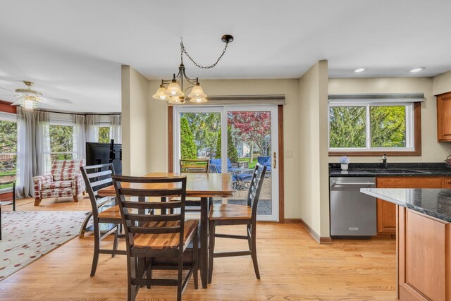 dining area featuring healthy amount of natural light, light wood-style floors, and recessed lighting