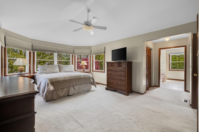 bedroom with carpet, baseboards, and a ceiling fan