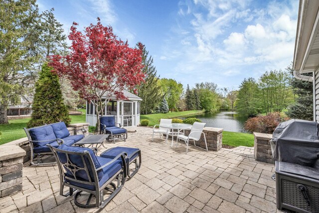 view of patio featuring a water view and an outdoor hangout area
