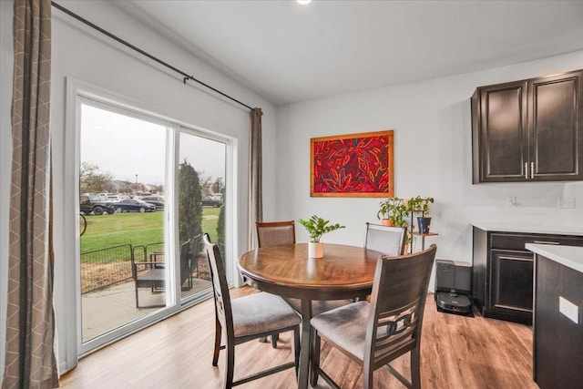 dining area featuring light wood-type flooring