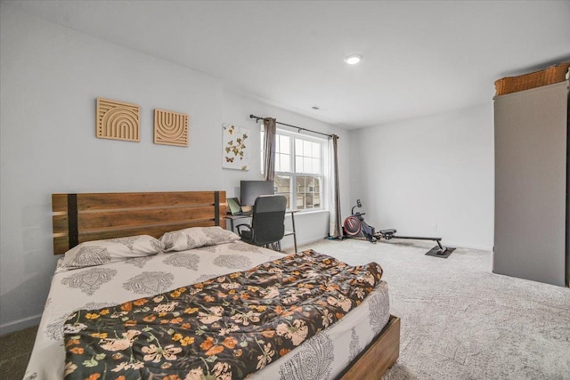 bedroom with carpet and baseboards