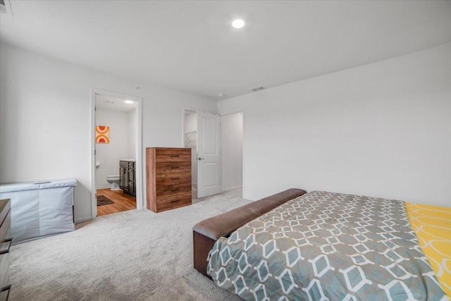 bedroom featuring visible vents, recessed lighting, carpet flooring, and connected bathroom