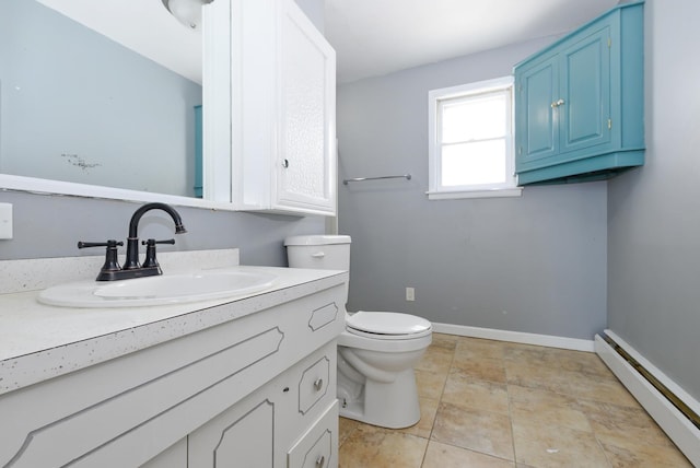 2644 Commercial Ave, South Chicago Heights, IL 60411 - bathroom with vanity, baseboard heating, baseboards, and toilet