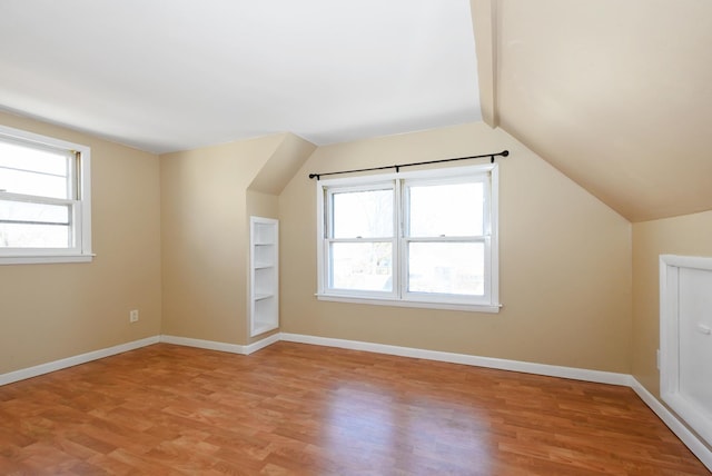 2644 Commercial Ave, South Chicago Heights, IL 60411 - additional living space featuring baseboards, light wood-type flooring, and vaulted ceiling