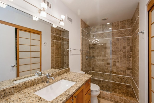 801 S Plymouth Ct Unit P, Chicago, IL 60605 - full bath featuring toilet, vanity, a tile shower, and visible vents