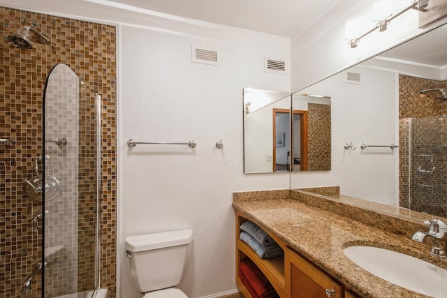 801 S Plymouth Ct Unit P, Chicago, IL 60605 - full bathroom with visible vents, toilet, tiled shower, and vanity