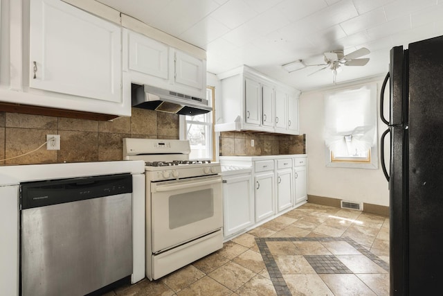 kitchen with white gas range oven, freestanding refrigerator, a ceiling fan, under cabinet range hood, and stainless steel dishwasher