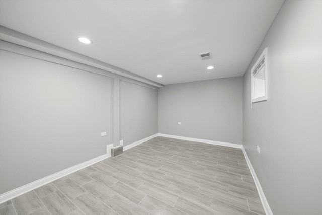 125 W 103rd Pl, Chicago, IL 60628 - finished basement featuring recessed lighting, visible vents, baseboards, and wood tiled floor