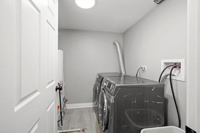 125 W 103rd Pl, Chicago, IL 60628 - washroom with independent washer and dryer, laundry area, baseboards, and wood tiled floor
