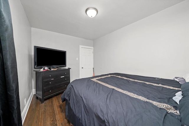 125 W 103rd Pl, Chicago, IL 60628 - bedroom featuring baseboards and dark wood finished floors