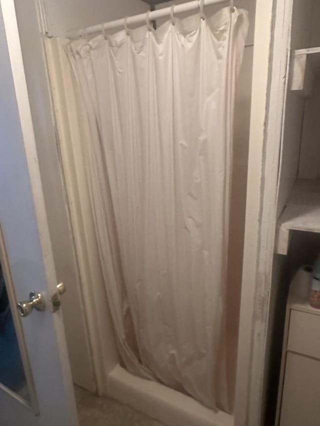full bathroom featuring a stall shower