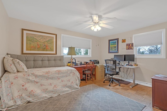 bedroom featuring baseboards and a ceiling fan