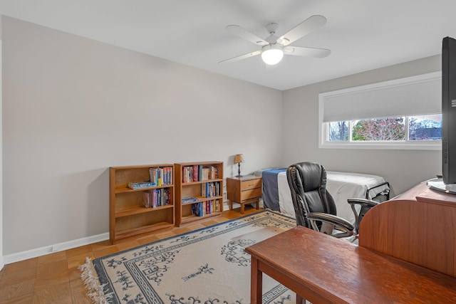 office with baseboards and ceiling fan