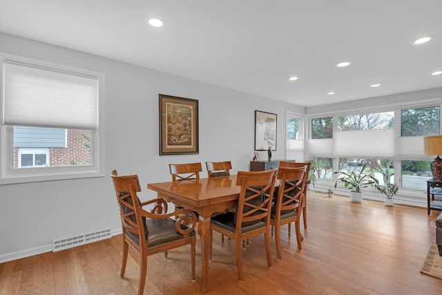 dining room with recessed lighting, baseboards, light wood-type flooring, and visible vents