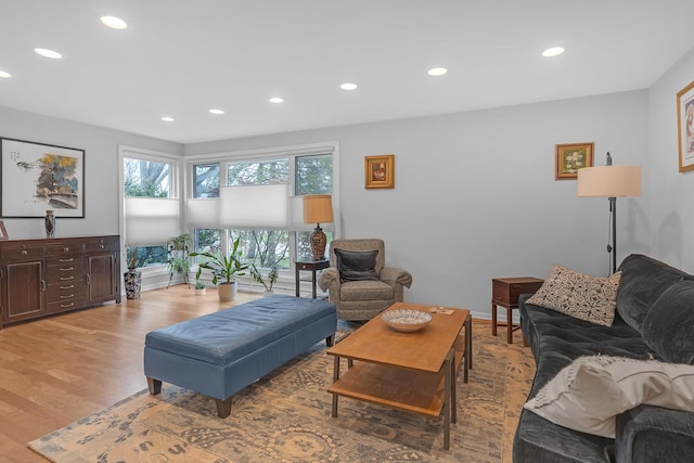 living room with recessed lighting and light wood-style floors