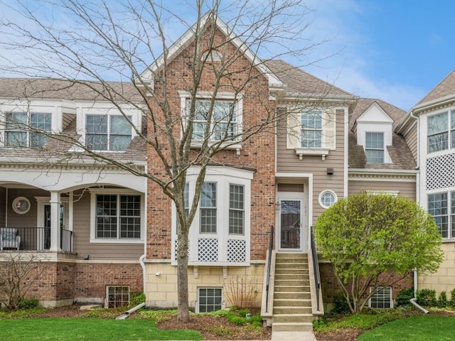 view of front of house featuring brick siding