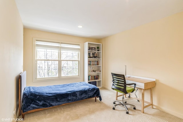 bedroom featuring baseboards and carpet floors