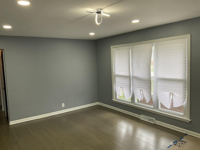 451 Clyde Ave, Calumet City, IL 60409 - spare room with visible vents, baseboards, recessed lighting, and dark wood-style floors