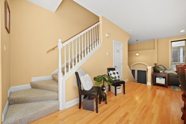 interior space featuring baseboards and wood finished floors