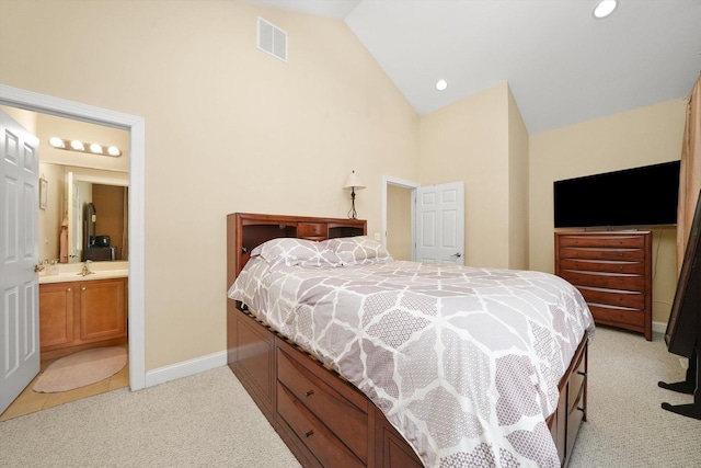 bedroom featuring visible vents, light carpet, baseboards, high vaulted ceiling, and a sink