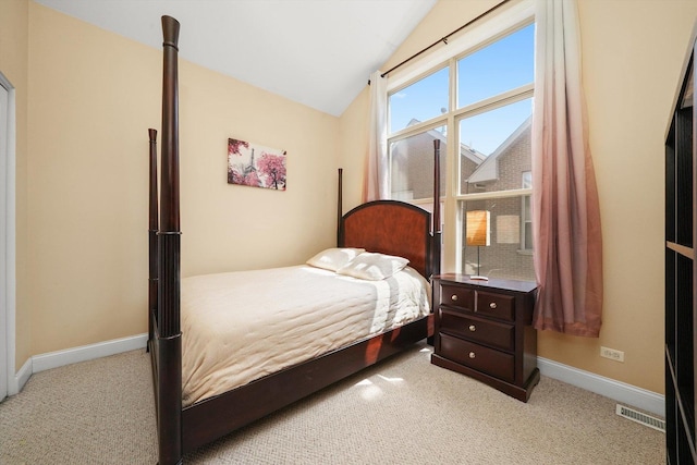 bedroom with baseboards, carpet, vaulted ceiling, and visible vents
