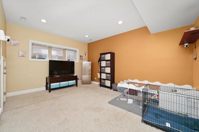 interior space with carpet floors, baseboards, and recessed lighting