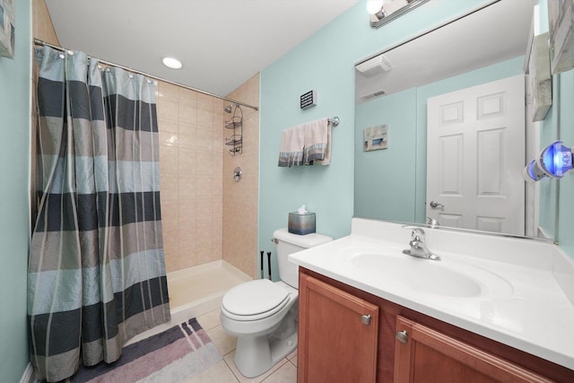 bathroom with vanity, visible vents, toilet, tile patterned floors, and a tile shower