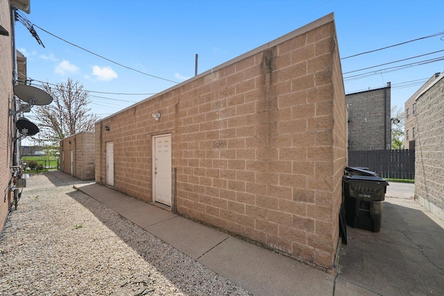 view of property exterior featuring fence