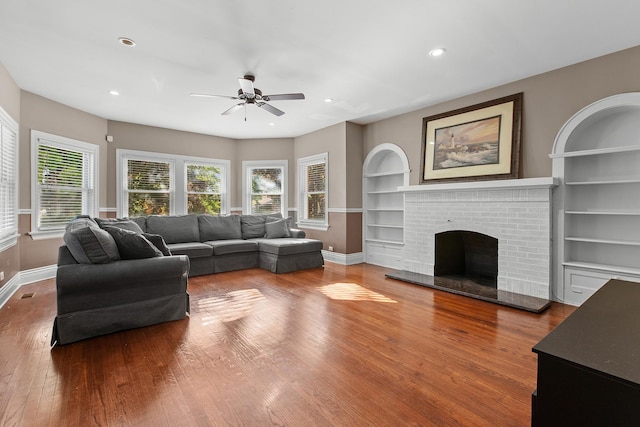 701 N 4th Ave, Maywood, IL 60153 - living room with wood-type flooring, baseboards, recessed lighting, ceiling fan, and built in shelves