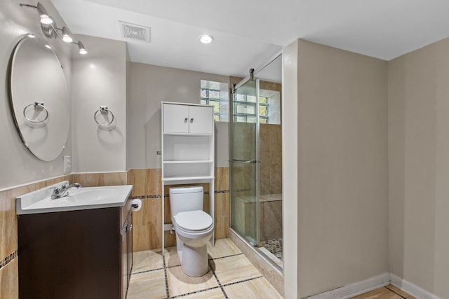 701 N 4th Ave, Maywood, IL 60153 - full bath with toilet, a stall shower, vanity, and visible vents