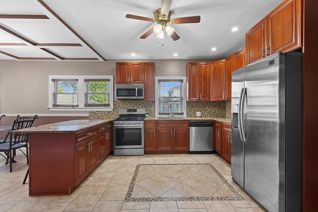 701 N 4th Ave, Maywood, IL 60153 - kitchen with recessed lighting, decorative backsplash, appliances with stainless steel finishes, and a peninsula