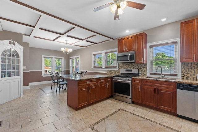 701 N 4th Ave, Maywood, IL 60153 - kitchen featuring a sink, stainless steel appliances, decorative backsplash, baseboards, and plenty of natural light